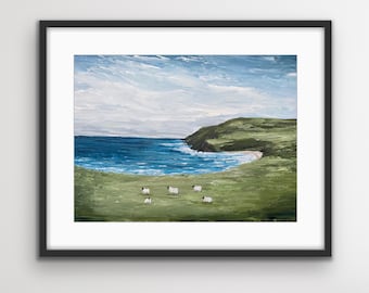 May include: A painting of a coastal landscape with a blue ocean, green hills, and a white sandy beach. A small group of sheep are grazing in the foreground.