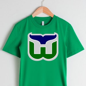 Buy the New England Whalers Ringer Tee by Slingshot Hockey