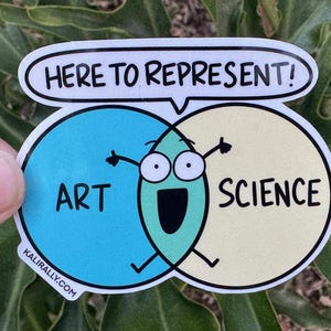 May include: A sticker with a green cartoon character representing both art and science. The character is drawn as a Venn diagram with the words "art" and "science" on each side. The sticker has the text "Here to represent!" above the character.
