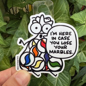 May include: A white sticker with a cartoon character made of colorful marbles. The character has a speech bubble that says "I'm here in case you lose your marbles."