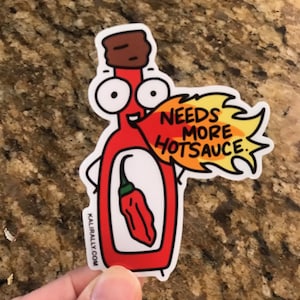 May include: A red cartoon hot sauce bottle with a chili pepper inside and a speech bubble that says "Needs More Hot Sauce".
