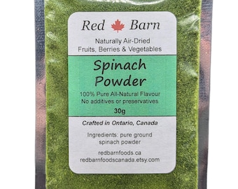 May include: A small silver pouch containing 30 grams of green spinach powder. The pouch has a label that reads "Red Barn Naturally Air-Dried Fruits, Berries & Vegetables Spinach Powder 100% Pure All-Natural Flavour No additives or preservatives 30g Crafted in Ontario, Canada Ingredients: pure ground spinach powder redbarnfoods.ca redbarnfoodscanada.etsy.com"