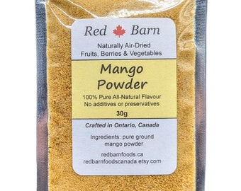 May include: A small pouch of mango powder, labeled "Red Barn Mango Powder". The pouch is made of clear plastic and has a silver zipper. The label is white with red and black text. The powder is a bright yellow color. The label states that the powder is 100% pure all-natural flavor, with no additives or preservatives. It is crafted in Ontario, Canada. The ingredients are pure ground mango powder. The label also includes the website redbarnfoods.ca and redbarnfoodscanada.etsy.com.