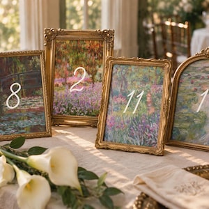 May include: Four ornate gold picture frames containing impressionist floral art prints. The frames display white numbers 8, 2, 11, and 1. The frames are rectangular and arched, featuring intricate embossed detailing along the edges of the metal borders.