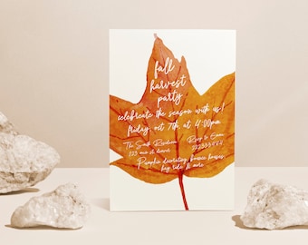 May include: Fall Harvest Party invitation with a watercolor illustration of an orange and red maple leaf. The text reads "fall harvest party celebrate the season with us! Friday, Oct 7th, at 4:00pm The Sat Redava 123 Main St Denver Rip to En 2323334444 Pumpkin decorating, bounce houses, hay ride & more"