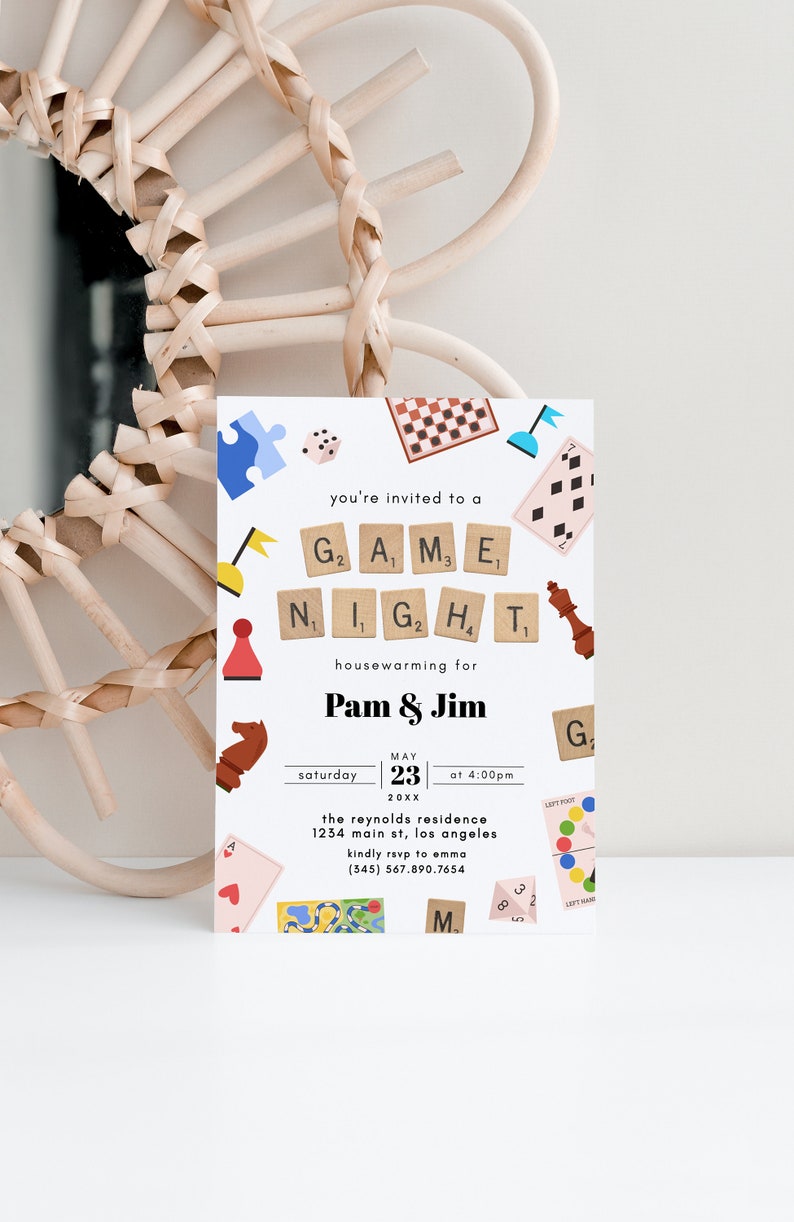May include: A white invitation card with colorful illustrations of board games, such as chess, checkers, and dice. The text reads "You're invited to a Game Night housewarming for Pam & Jim, Saturday, May 23rd, 20XX at 4:00 PM. The Reynolds Residence, 1234 Main St, Los Angeles. Kindly RSVP to Emma (345) 567.890.7654."
