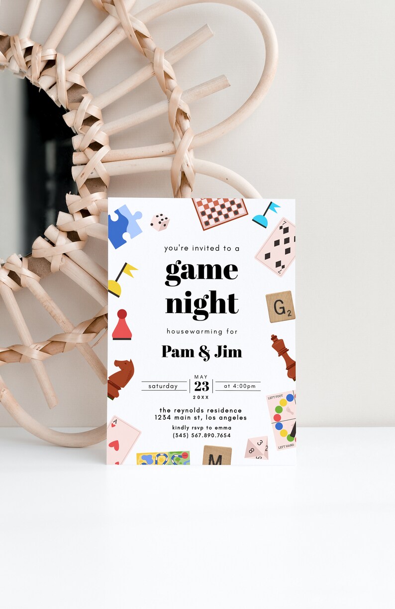 May include: A white invitation card with colorful illustrations of board games and the text "you're invited to a game night housewarming for Pam & Jim Saturday May 23 at 4:00pm 20XX the reynolds residence 1234 main st, los angeles kindly rsvp to emma (345) 567.890.7654"