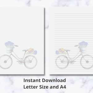 May include: A printable lined paper with a watercolor illustration of a bicycle with flowers in the basket. The bicycle is on a white background with blue lines.