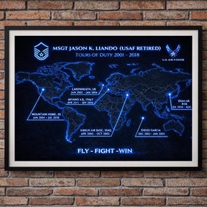 May include: Framed print featuring a world map with highlighted locations and text. The map is illuminated in blue, with text indicating tours of duty from 2001-2018. The phrase "FLY - FIGHT - WIN" is at the bottom.