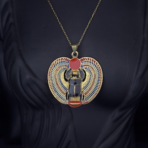Ancient Egyptian Winged Scarab Pendant Necklace – Gold and Black Enamel Jewelry with Red Sun Disc and Detailed Wings Made in Egypt