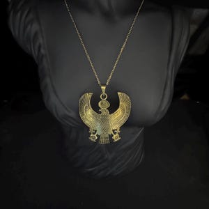Curved Egyptian Horus Falcon Pendant Necklace Gold Tone Brass Statement Amulet with Ankh and Sun Disk Handmade Jewelry Made In Egypt