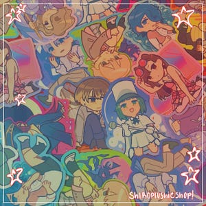 May include: A colorful assortment of anime-style stickers featuring various characters in different poses. The stickers have a glossy finish and are arranged in a random pattern. The text "ShiroPlushieShop!" is visible in the bottom right corner.