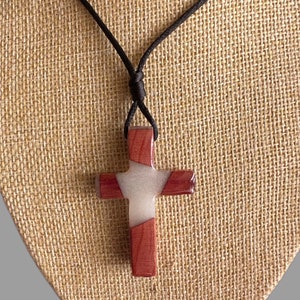 2” Handcrafted Cedar cross necklace with resin inlay.