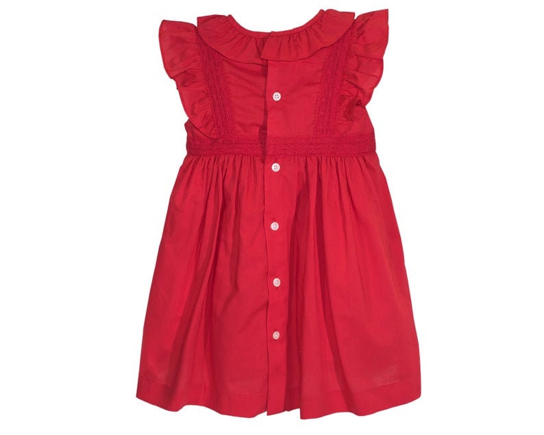 May include: A red sleeveless dress with a white ruffle collar and button fastenings down the front.