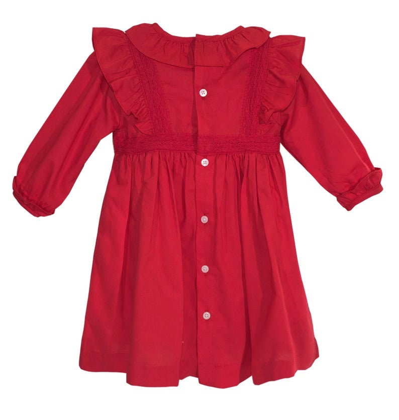 May include: A red long-sleeved dress with a ruffled collar and a button-up front. The dress has a gathered skirt and is made of a lightweight fabric.