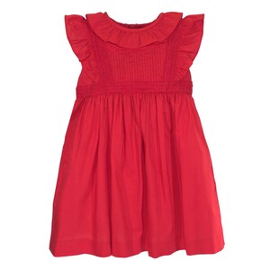 May include: A red sleeveless dress with a ruffled collar and a gathered skirt.