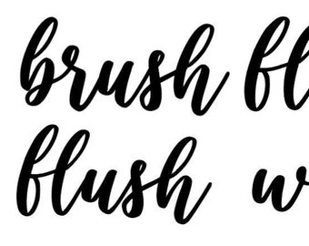 May include: Black and white calligraphy text on a white background. The text reads "brush floss flush wash".