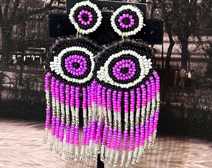 Protective eye earrings
