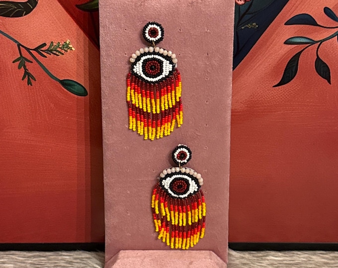 Protective eye earrings