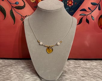 Thread necklace with amber heart pendant
