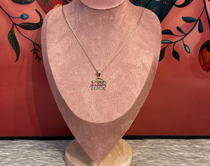 Necklace with pendant of 2 boys and 1 girl