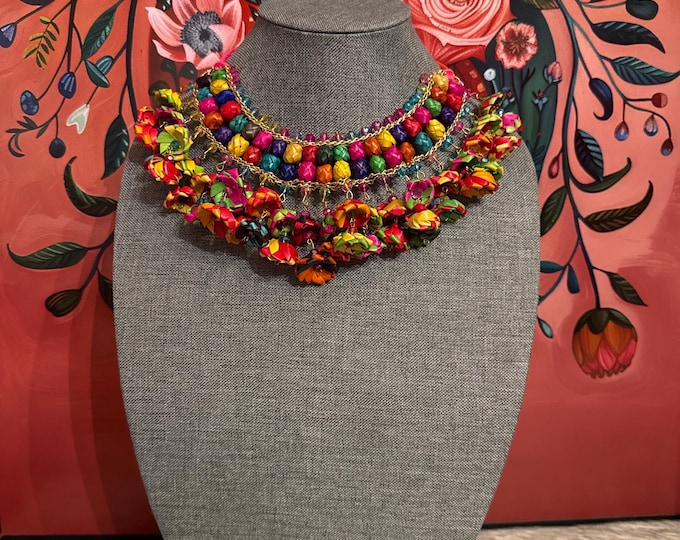 Bib necklace with flowers and palm barrels with earrings