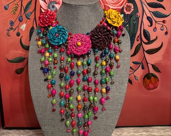 Necklace of flowers and palm barrels