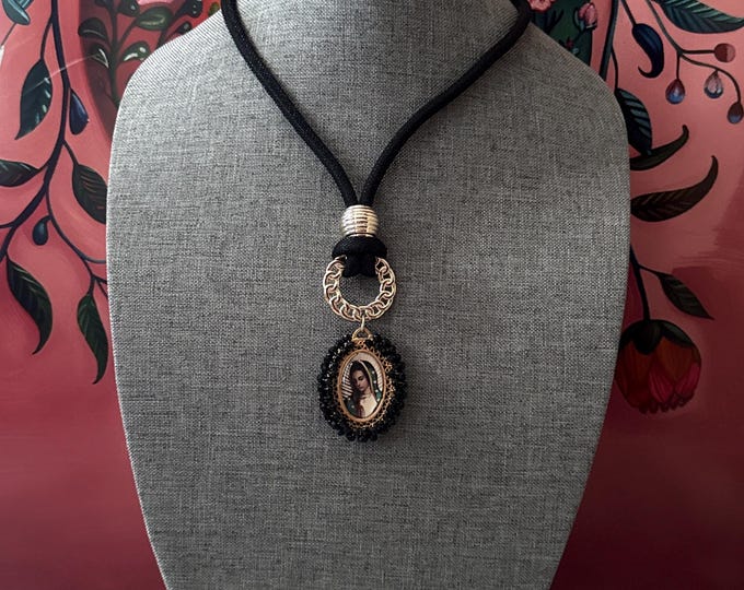 Necktie necklace with a double-sided medal of the Virgin of Guadalupe and the Angel Gabriel