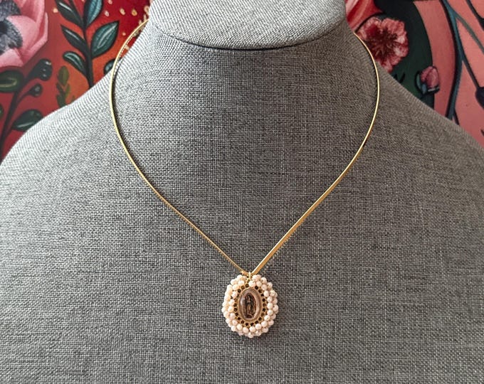 Gold choker with a small medal of the Virgin of Guadalupe