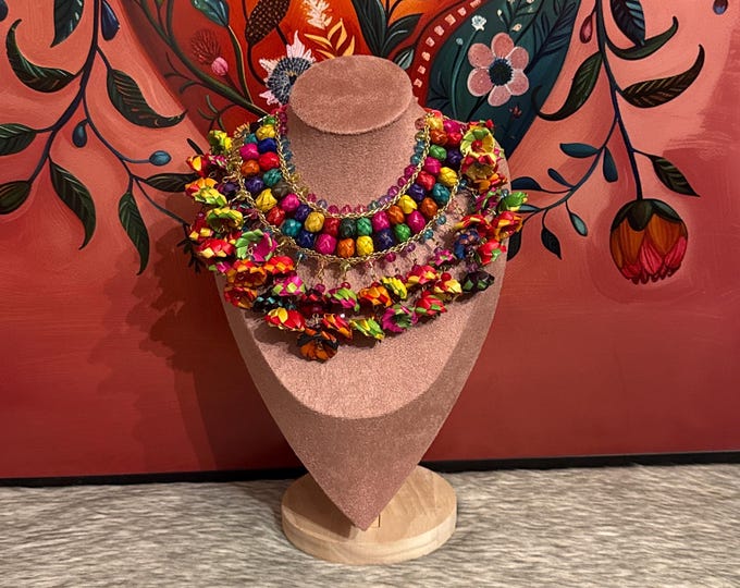 Bib necklace with flowers and palm barrels with earrings
