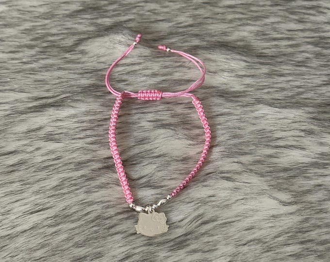 Thread bracelet with Hello Kitty pendant