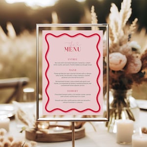 May include: A pink and red menu card with a wavy border. The menu card has the text "The Menu" at the top and lists the entree, mains, and dessert options. The text on the menu card is in a white font.