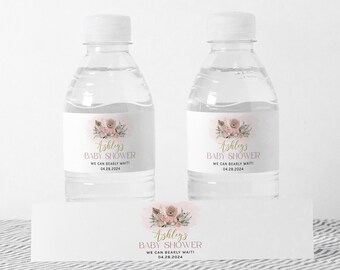 May include: Water bottle labels with a pink and gold design featuring a teddy bear, flowers, and the text "Ashleys Baby Shower We Can Bearly Wait! 04.28.2024".