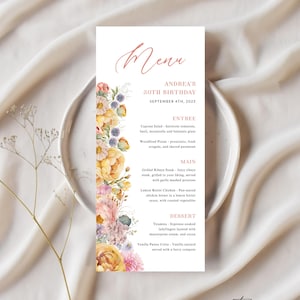 Może przedstawiać: Drukowana karta menu z kwiatowym wzorem w odcieniach żółtego, różowego i niebieskiego. Tekst brzmi: "Menu", "Andrea's 30th Birthday", "September 4th, 2025", "Entree", "Caprese Salad", "Woodfired Pizzas", "Main", "Grilled Ribeye Steak", "Lemon Butter Chicken", "Dessert", "Tiramisu", "Vanilla Panna Cotta" i "picofee PRINTERIE".