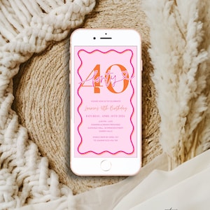 May include: A smartphone displays a pink and orange birthday invitation. The invitation reads "40" with "forty" written below. Details include the date, time, location, and RSVP information for Lauren's 40th birthday celebration.