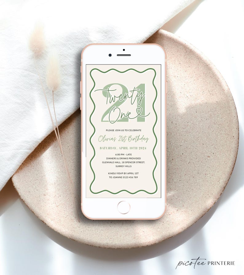 Peut inclure: Une invitation num&eacute;rique pour une f&ecirc;te de 21e anniversaire. L'invitation est con&ccedil;ue pour ressembler &agrave; l'&eacute;cran d'un smartphone et pr&eacute;sente une illustration verte et blanche du chiffre 21 avec le texte "Twenty One" et un c&oelig;ur. L'invitation comprend le texte "Veuillez vous joindre &agrave; nous pour c&eacute;l&eacute;brer le 21e anniversaire d'Olivia" et des d&eacute;tails sur la f&ecirc;te, y compris la date, l'heure, le lieu et les informations de RSVP.