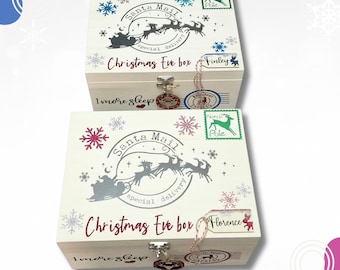 May include: Two white wooden boxes labeled Christmas Eve box with Santa Mail graphics, reindeer silhouettes, and North Pole stamps. The boxes feature the text 1 more sleep, decorative snowflakes, and personalized name tags for Finley and Florence.