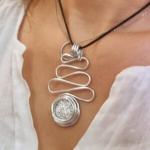 Black leather choker with a silver wire wrapped sparkly pendant. Big pendant statement necklace, black leather necklace