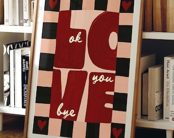 May include: A framed art print with a wooden frame. The artwork features the word "LOVE" in large, maroon letters, with the words "ok", "you", and "bye" in smaller text. The background has a checkerboard pattern in black, pink, and white, with red heart accents.