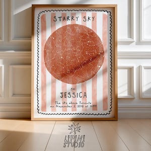 May include: A framed print featuring a star map with a rust-colored circle at the center, displaying constellations. The print includes the text "STARRY SKY" and "for JESSICA", with details about the sky above Toronto on November 2, 2018 at 11:44. The frame is wooden.