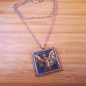 Clockwork angel necklace that ticks discount