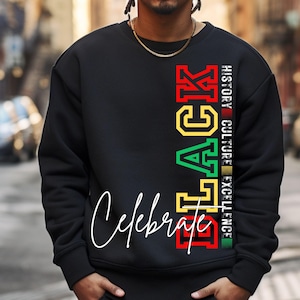 May include: Black sweatshirt with the word "BLACK" in red, yellow, and green letters, and the words "HISTORY, CULTURE, EXCELLENCE" in smaller letters to the right of the word "BLACK". The words "Celebrate" are written in white cursive below the word "BLACK".