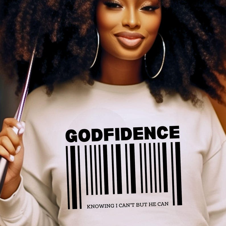 May include: White sweatshirt with black text that reads "GODFIDENCE" and a barcode underneath. The text below the barcode reads "KNOWING I CAN'T BUT HE CAN".