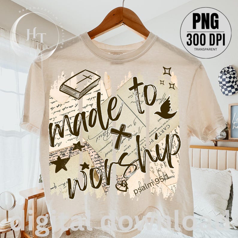May include: Cream-colored t-shirt with the words "made to worship" in a handwritten style. The design includes a cross, a dove, stars, and a book. The text "psalm 95:1" is also visible.