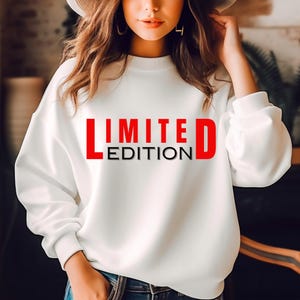 May include: White sweatshirt with the text "LIMITED EDITION" in red and black letters.