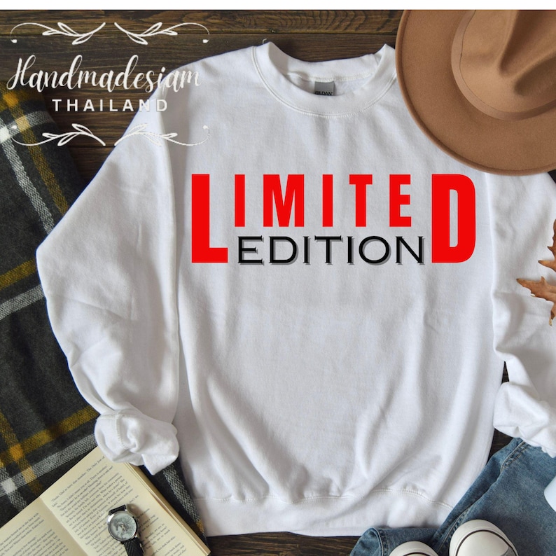 May include: White sweatshirt with the text "LIMITED EDITION" in red and black letters.