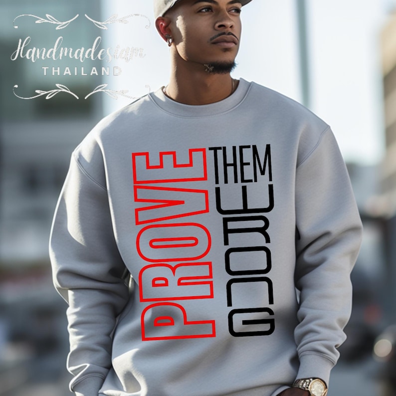 May include: A gray sweatshirt with the words "PROVE THEM WRONG" printed in red and black.