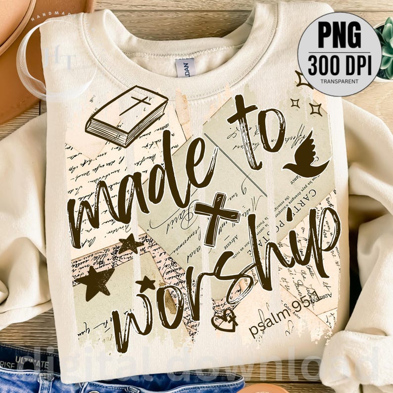 May include: Cream-colored sweatshirt with the words "made to worship" in a dark brown script. The design includes a cross, stars, a dove, and a book illustration, with a vintage postcard collage background.