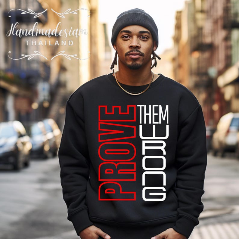 May include: Black sweatshirt with the words "PROVE THEM WRONG" printed in red and white letters.