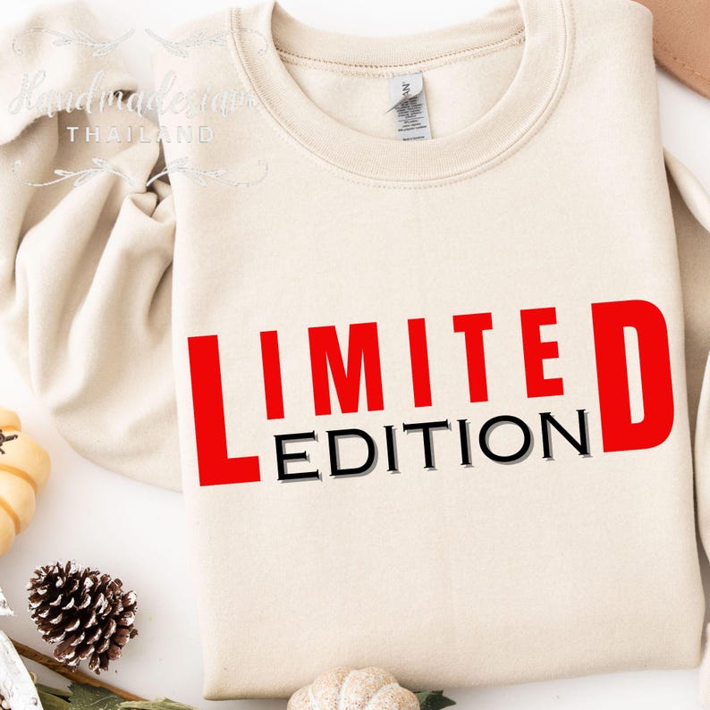 May include: A beige sweatshirt with the text "LIMITED EDITION" in red and black letters.